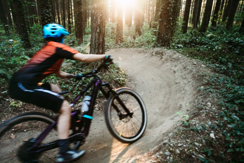 Person Riding A Big Sky Mountain Bike Trail