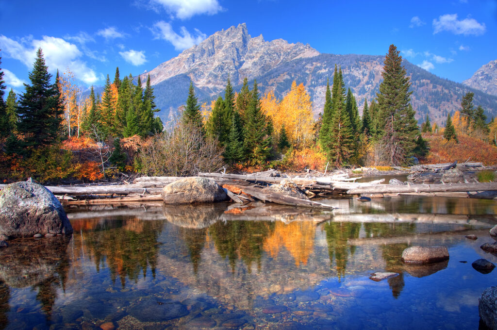 Teton Range Reflection during fall on Jenny Lake, Wyoming, America.