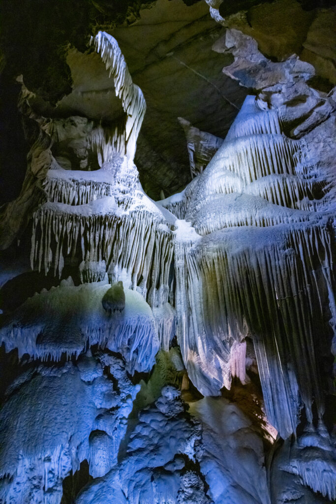 Formations inside Crystal Cave Sequoia/Kings Canyon National Park with blue lighting.