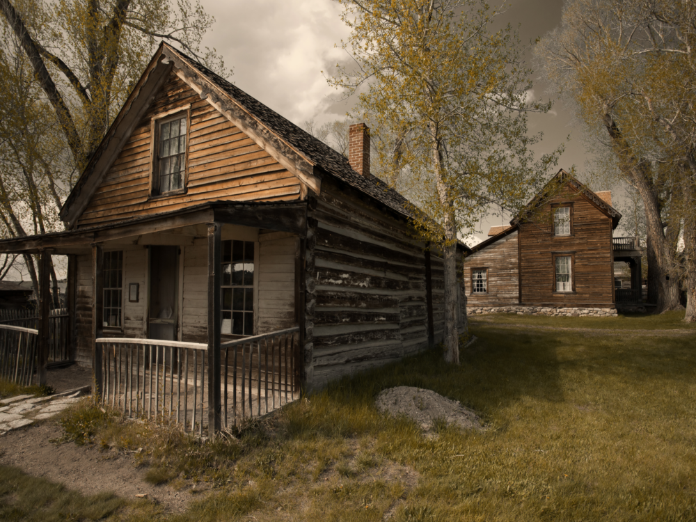 Old abandoned wooden houses at a ghost town on Nevada City, captured in a gloomy mood for a piece on the best things to do in Montana